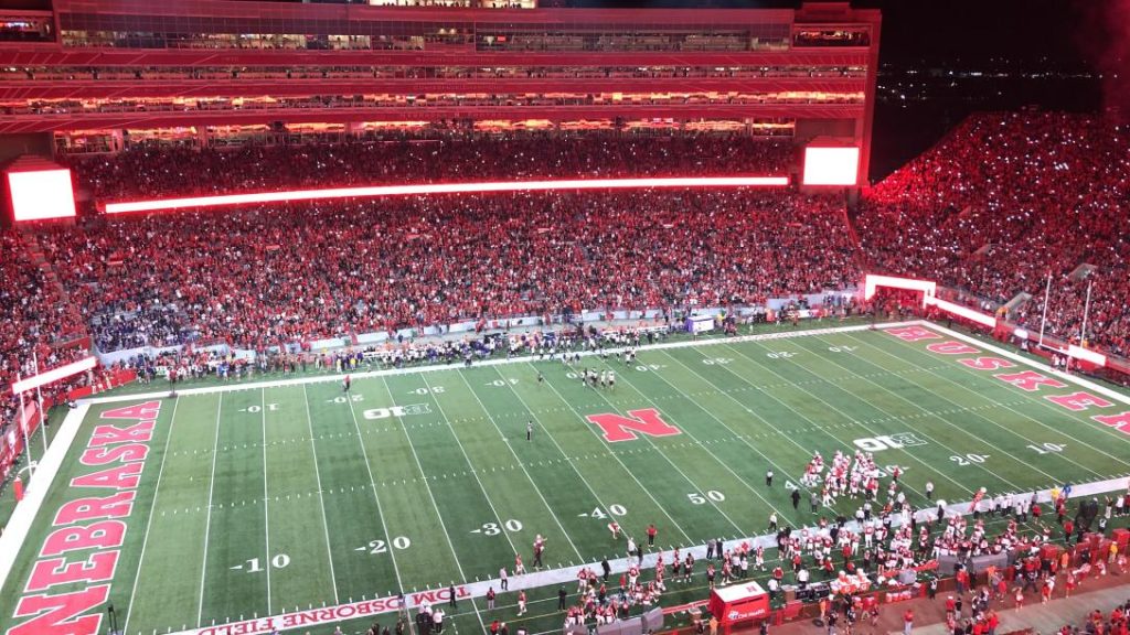 A panoramic view of Memorial Stadium during a Nebraska football game, showcasing the electrifying atmosphere of the 2025 season.