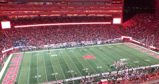 A panoramic view of Memorial Stadium during a Nebraska football game, showcasing the electrifying atmosphere of the 2025 season.