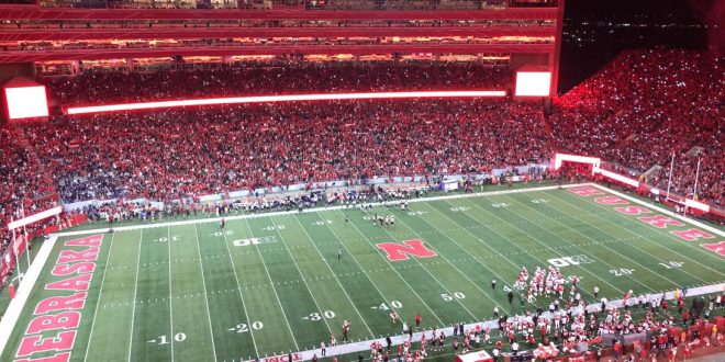 A panoramic view of Memorial Stadium during a Nebraska football game, showcasing the electrifying atmosphere of the 2025 season.