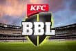 "KFC BBL logo displayed in a cricket stadium with a vibrant sunset in the background."